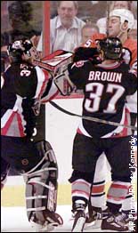 Dominik Hasek, Keith Primeau and Curtis Brown